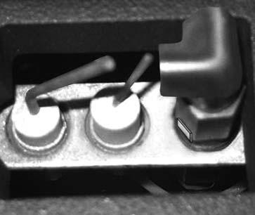 Lift the control box shield and rest on the edge of the screw above the access hole (Fig.