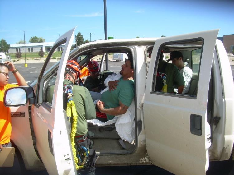 First Aid The Scenario: An ambulance was transporting a patient to the hospital when it was in a near head on collision with a mine operators truck transporting three mine employees.