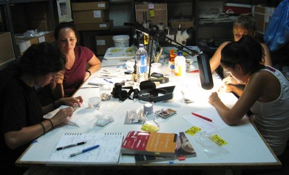 Conservation staff and students at work on artifacts from Methone in conservation lab Since the field season ended September 12, project members are still processing photographs, plans and drawings,