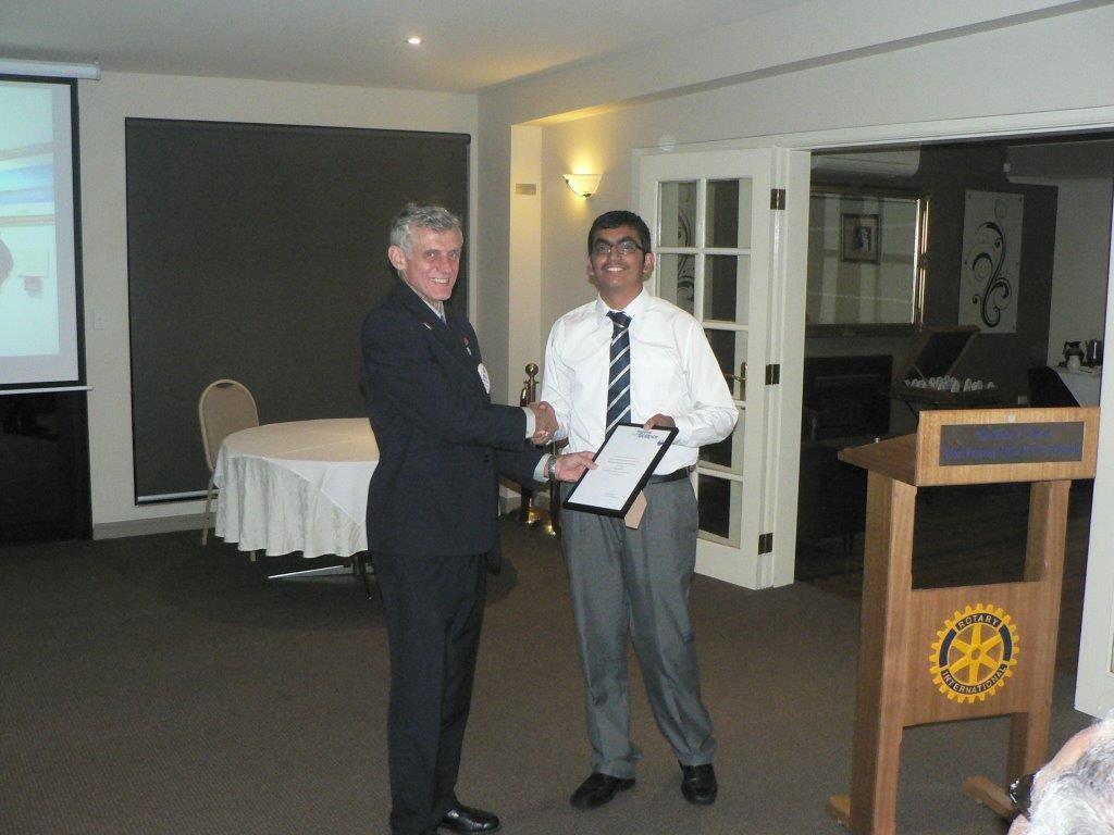 Mehul Gajwani presenting President Bob Davsion with a certificate