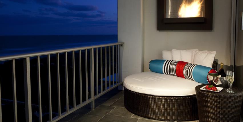 In-Room Sitting / Meeting Area Complimentary WiFi Boca Terry Spa Robes Mini Fridge Keurig Coffee Maker Bitel Mobile Charging Station tub with flat screen TV, and includes ocean views from both spaces.