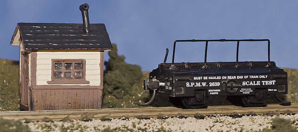 Top: One of Gary s scale houses from his layout is complemented by a scale test car brought by Stewart Jones. Bottom: Another scale house from Gary s layout, this model is fully detailed inside.