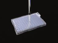 PTFE sealing film has an adhesive free area around each well so plastic pipette tips and metal probes stay clean.