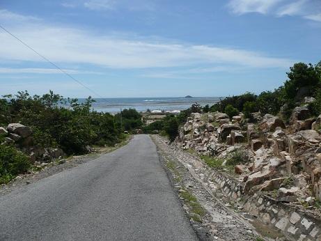 Continuing south of Vinh Hy Bay, the road descends from the hills back down to the coast. A remarkable change in weather and topography occurs at this point.