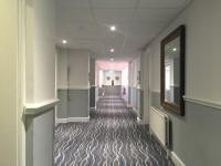 There is some ooring in corridors/walkways which includes patterns or colours which