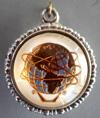 0 Lot # 365 - Charm with Unisphere on one side and writing on the other. The Unisphere is in gold with butterfly wings for a background, surrounded by white.