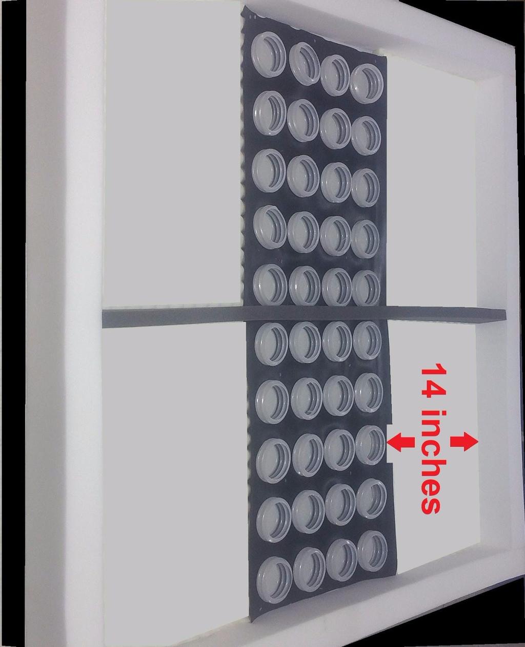 5 inch wide gray foam center divider, it might be separate or adhered to the tray. The divider that is separate can be placed now or later.