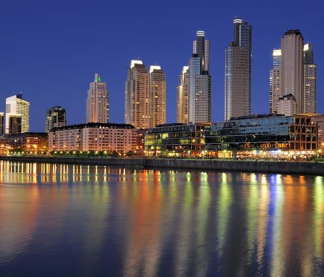 The buildings of Buenos Aires glow in the waters of the port at night. Conclusion Argentina is a country with citizens from all over the world.