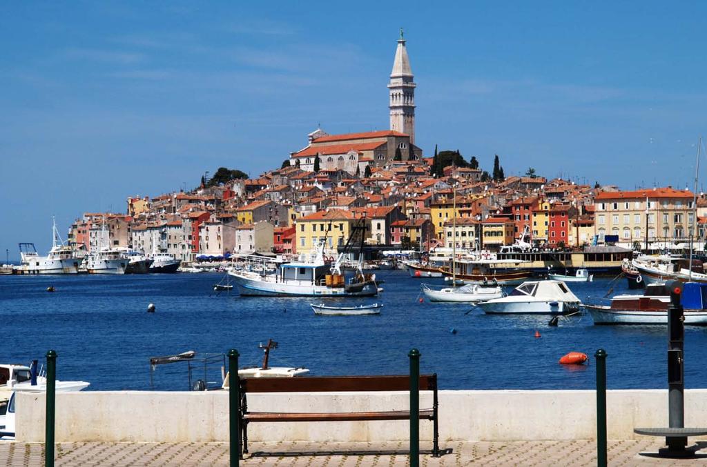 Istria Lively fishing boats and teeming narrow stone streets The blueness of its shoreline is contrasted by the lush greenery of its interior and the