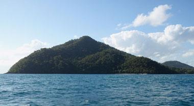 approaching Dunk Island from Mission Beach the rocky north east coast