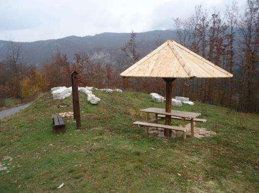 wooden shelter with two benches and one table as presented in the approved project application with