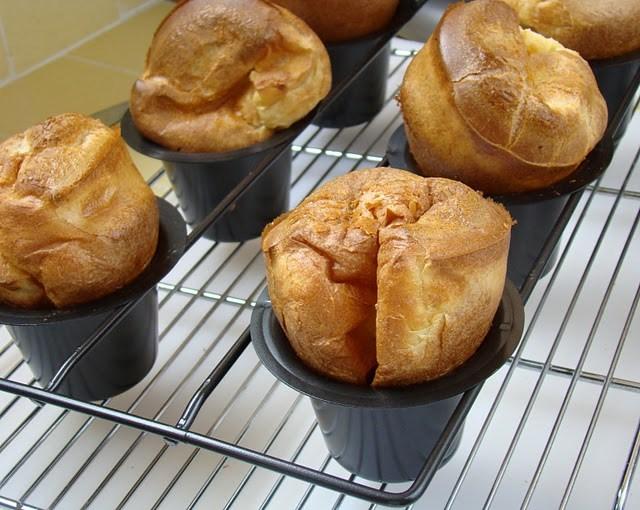 JULIA CHILD S WONDERFUL POPOVERS Makes 9-10 1 c flour 1 c whole milk, room temp ½ tsp salt 3 large eggs, room temp 2 T unsalted butter, melted melted butter for greasing cups Position a rack on the