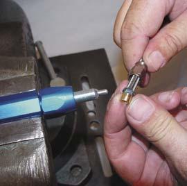 1 1 8Position nipple end in vise and firmly clamp. Slip the hose and olive carefully onto the nipple stem.