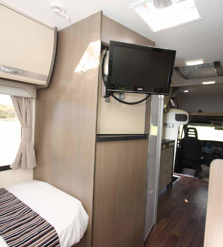 Lounging Around With the slide-out open and the cab seats swivelled around, there is plenty of space in the front area.
