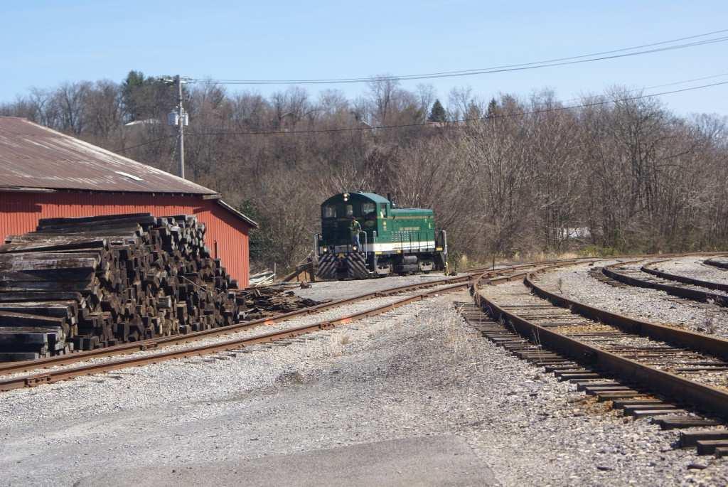 NS did so proficiently, backing the excursion train into the yard. But with an oncoming train, safety dictated that the workers remain onboard until the first merchandiser had cleared.