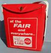 Lot # 213 - Vinyl Cooler from Coca-Cola with "at the Fair and everywhere things go better with Coke" written on the front. The bag is red with white writing and a white handle.
