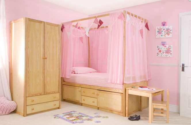 Four Poster Bed This bed has two drawers and two cupboards for storing items but with four posts above the