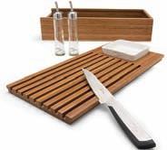 The lid transforms into a bamboo cutting board with space for the ceramic tapas bowl. Also included is a bread knife and two drizzler for oil and vinegar.