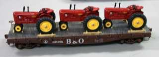 Dave added 3 ERTL Farmall trackers secured with wheel blocks and tie-downs.