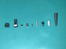 2. COMPLETE PARTS: Parts for FOCI MT-RJ connector (from left to right) Dust cover Body, connector Pin keeper Ferrule (MM) Ferrule, Boot, Spring Spring push Crimp eyelet Boot 3.