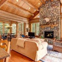 â The airy great room has a well adorn seating area in front of a 25' stone wrapped, wood burning fireplace.