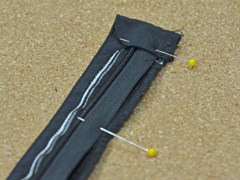 Step 15 Pin the length of the zipper to the webbing, making sure