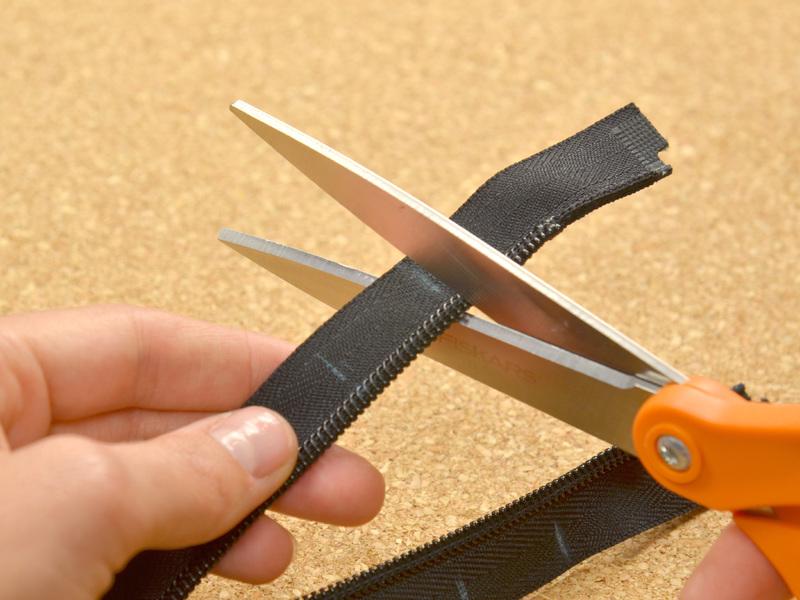 Measure two inches above that line and make a second mark with your tailor s chalk. Cut the zipper at the first mark you made.