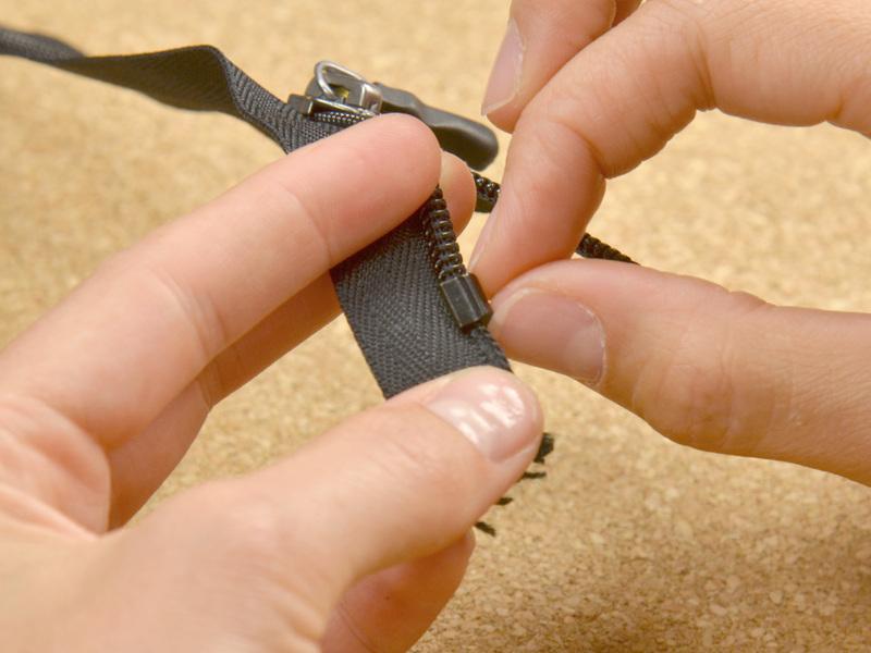 Step 7 Use end nipper pliers to cut off all of the zipper teeth above the first mark.