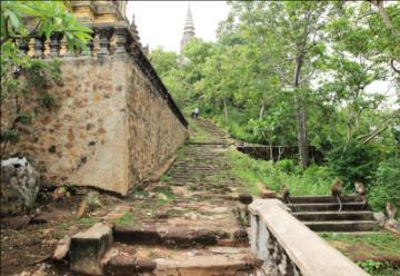 ACTIVITY PHNOM PENH VISIT PHNOM OUDONG About 40 kilometers northwest of Phnom Penh along National Route 5, a mountain topped with the spires of stupas rears from the plain like a fairytale castle.