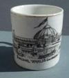 Lot # 15 - Small white china mug with black image of "Horticultural Building World's Columbian Exposition". It has a gold rim at the top and is marked in gold on the bottom: "Made in Germany".