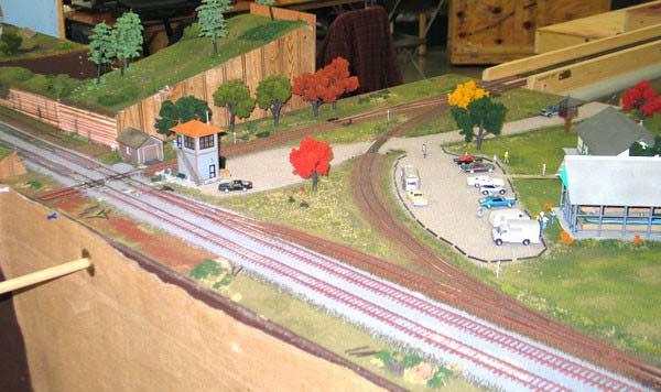 Many model railroaders build a dummy diamond, where the trains cross only on one of the two tracks. In this way, the diamond is only cosmetic, yet still establishes the location as a junction.