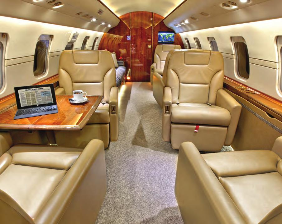photo from 7 SN 5729 is configured for 10 passengers, including a 4-place club arrangement in the forward cabin and a 4-place divan opposite a 2-place club setting in the aft cabin.
