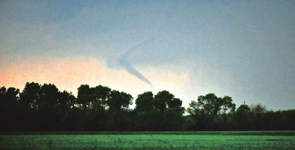 TORNADOES A tornado is a violently-rotating column of air that stretches between a thunderstorm cloud and earth s crust. Approximately 1,200 tornadoes hit the U.