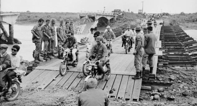The bridge had been heavily guarded, but the Viet Cong Sappers used the outgoing tide to float packs of explosives up to the bridge. A simple timing device set the charge off.