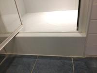 There is a built in seat in the shower cubicle.