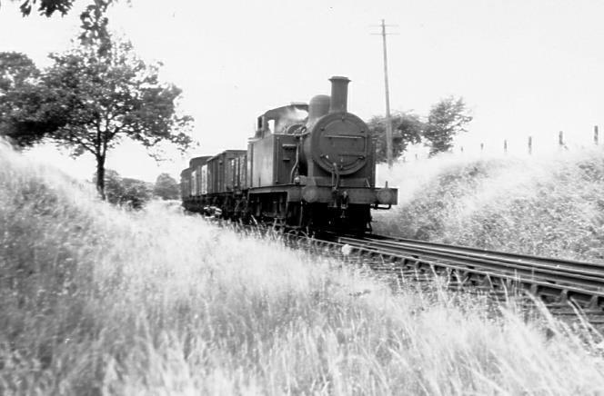 Left: The rural nature of the Rickmansworth branch line is obvious here on 4 July 1952 with the morning freight train from Rickmansworth Church Street to Watford, four months after