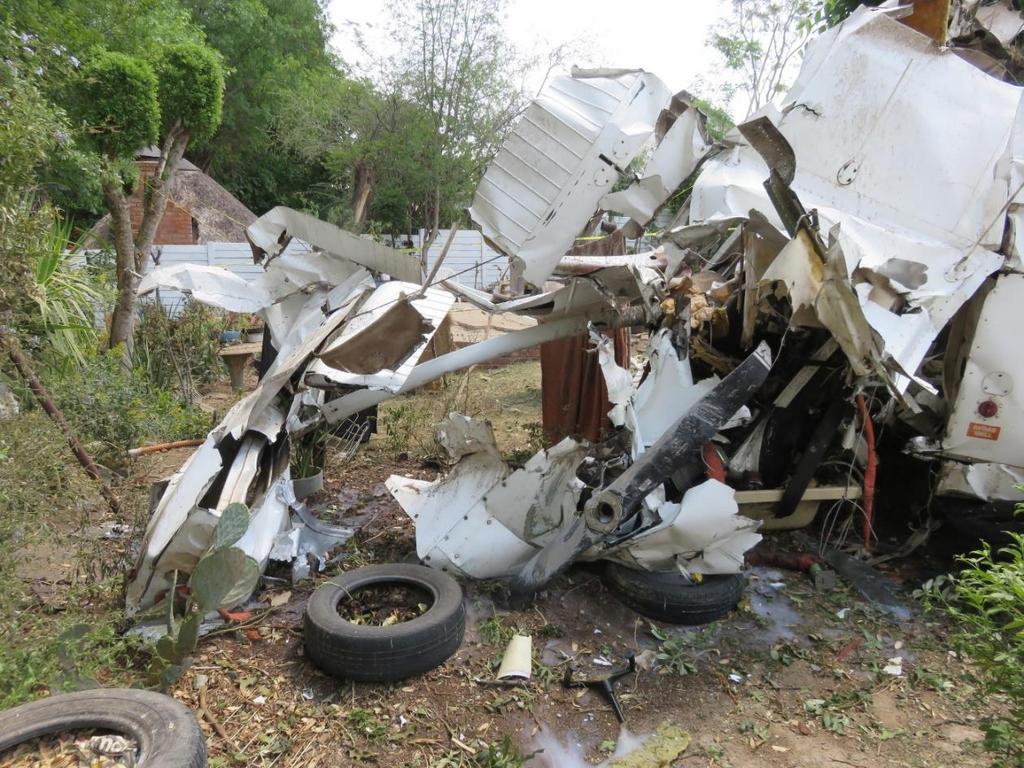 Right wing Left wing Engine and propeller Cabin area Figure 5: Front view of the aircraft wreckage Findings 4.
