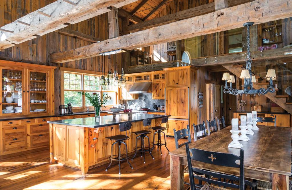 The kitchen and dining area fills half the lower level in the original barn. Hemlock covers the walls and floors.