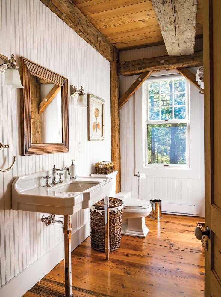 OPPOSITE: Beadboard walls, a square, wallmounted farmhouse sink and baskets play along with the upcountry atmosphere throughout the barn.