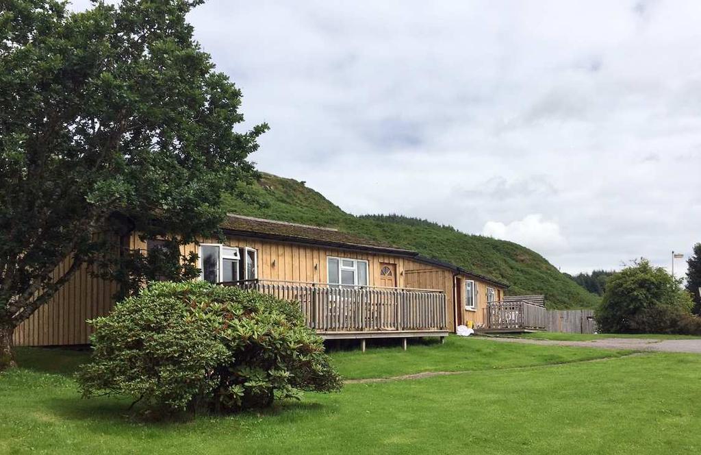 THE PROPERTY Cologin Lodges is an established park with 18 comfortable lodges in 2 different styles, each designed to offer an enjoyable holiday experience, blending into the surrounding countryside.