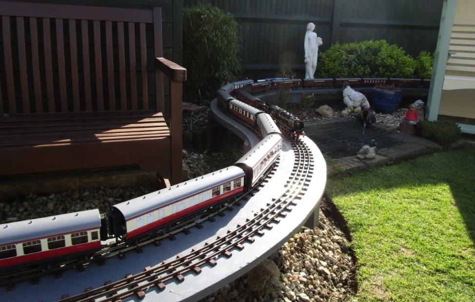 He runs a 2-rail coarse scale outdoor layout in his garden and has a superb feature with a 60ft long viaduct on cast concrete supports.
