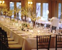 The ballroom fills with natural light as the sun beams through the French doors and windows.