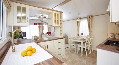 Features include floor to ceiling wardrobes, dressing table and stool, over bed