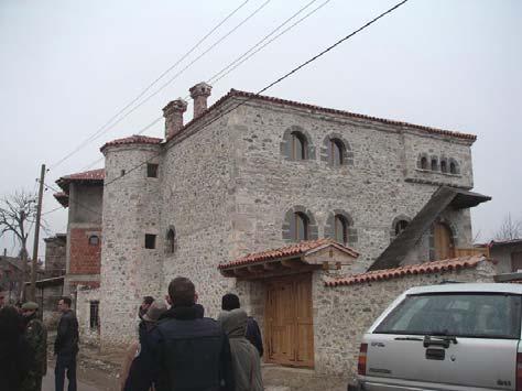 town house with an open gallery and the impressive stone tower-residence called kulla (Turkish