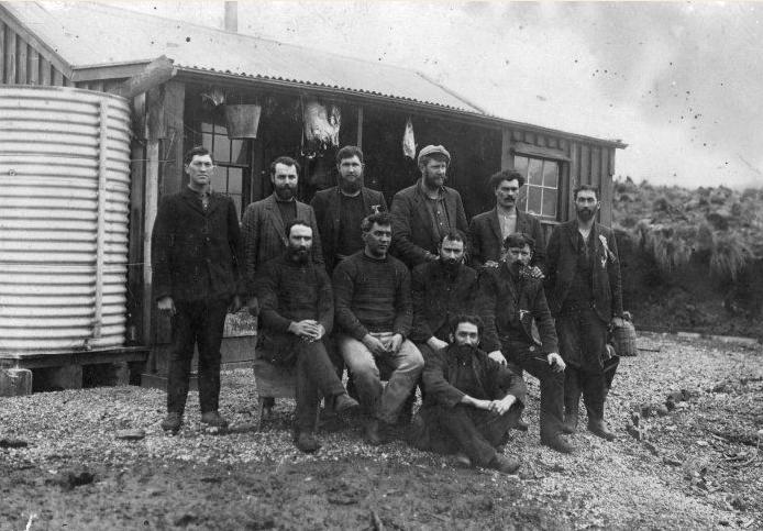 Four Shetlanders whom Tucker assisted to migrate to New Zealand for the purpose of engaging them on his Campbell Island lease are, front row, first from the left; Andrew Nicolson, fourth with cap;