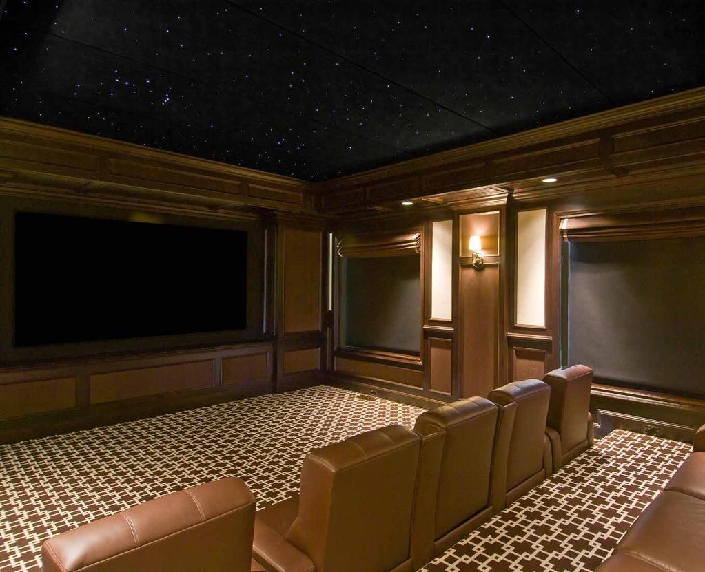 CUSTOM HOME THEATRE The 10-seat movie theatre features interactive stadium seating, black out shades,