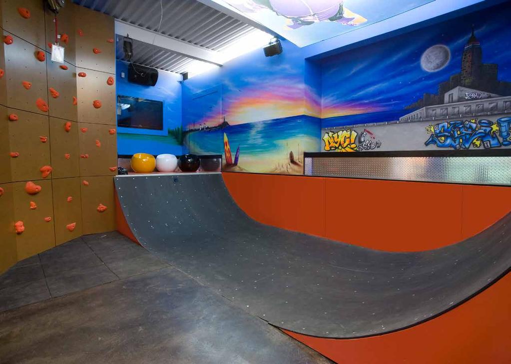 ENTERTAINMENT LOUNGE The 2,000 SF+/- state-of-the-art entertainment lounge features a rock-climbing wall, skateboarding half-pipe, arts and crafts area, DJ