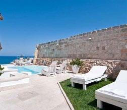 The comfortable rooms have vaulted ceilings and limestone floors. A terrace overlooks the sea and an outdoor pool.