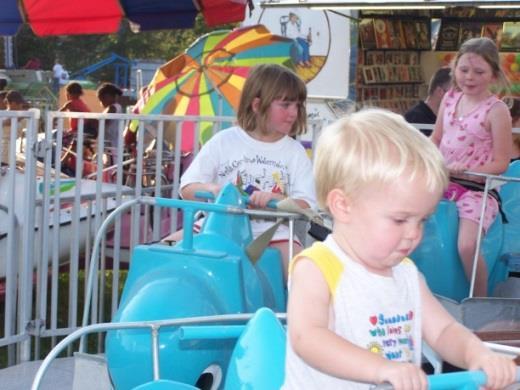 This magical kiddie ride features train cars and keeps little conductors coming back again