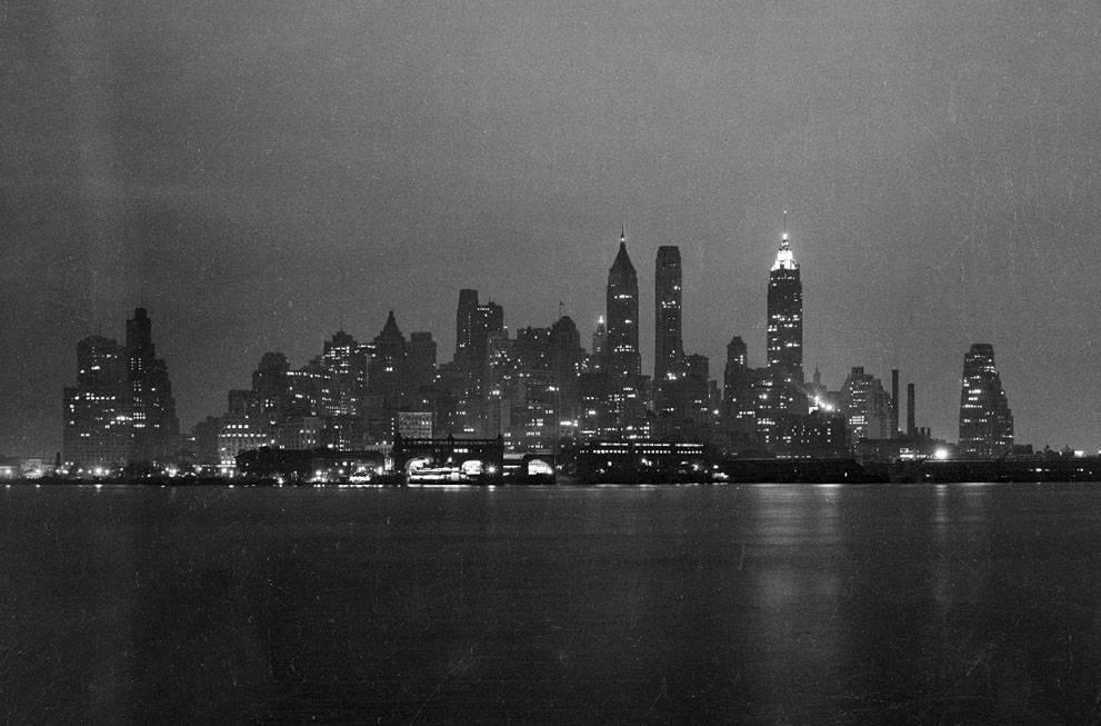 Lower Manhattan skyline at night, seen from either the